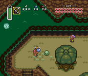 A gameplay screenshot of Link in the Light World (top) and the Dark World (bottom)